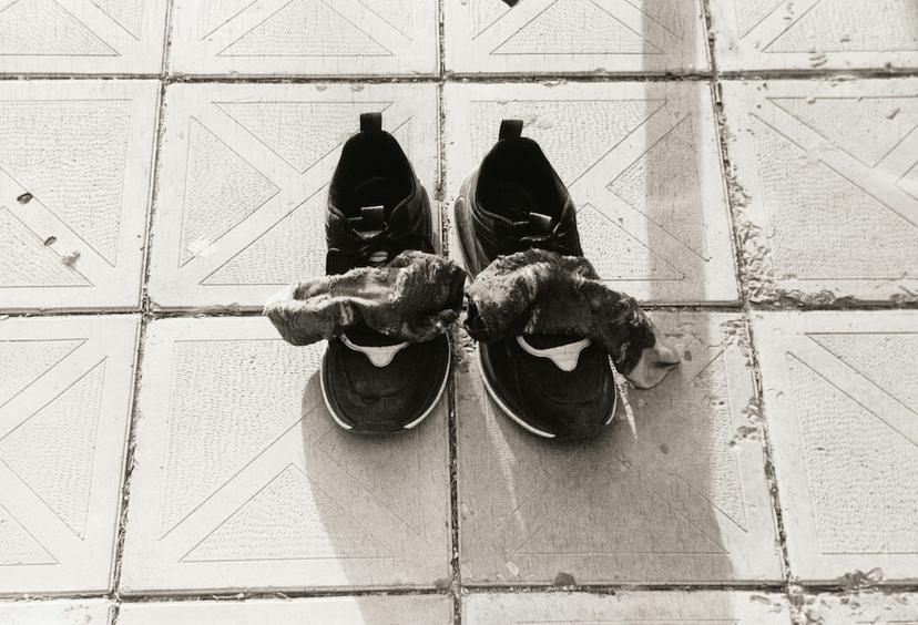 A pair of sports shoes with socks on top