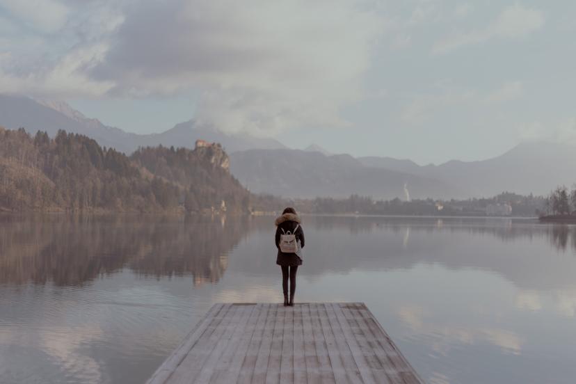 Woman standing on the end of a pier