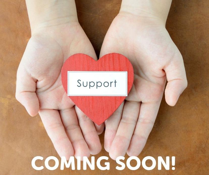 Hands holding a heart that says support coming soon