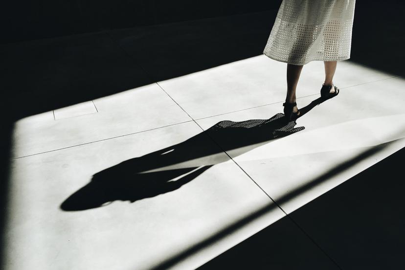 A phot of a womans shadow spread across the floor